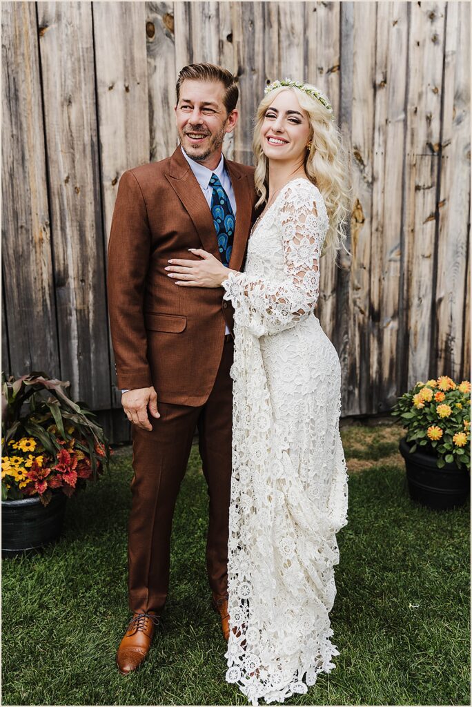 A bride and groom pose for a New York State wedding photographer.