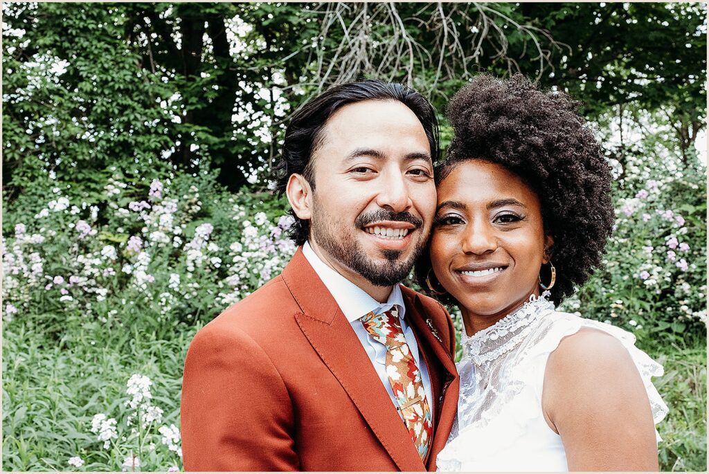 A bride and groom pose for a New York wedding photographer.