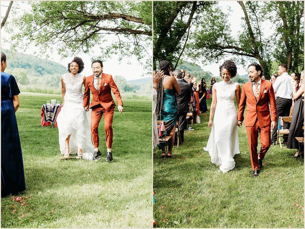A bride and groom jump the broom at a multicultural wedding.