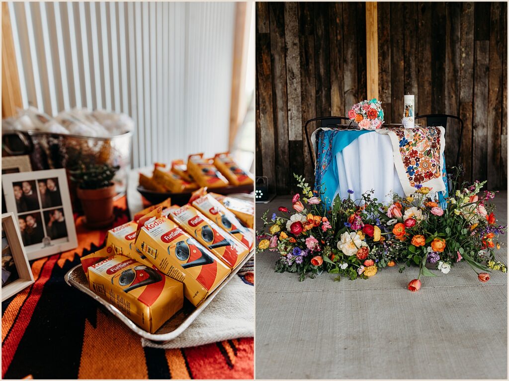A sweetheart table is decorated with colorful textiles and flowers.