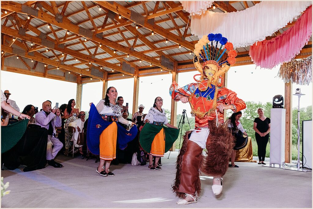 A masked dancer enters a wedding reception.