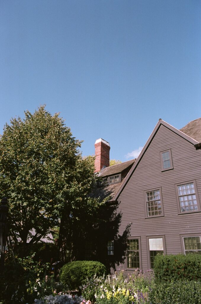 The sun shines on a black house.