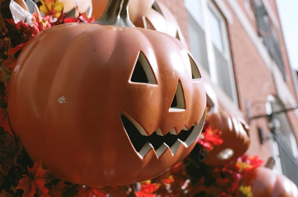 A jack-o-lantern sits in a store window in Salem.