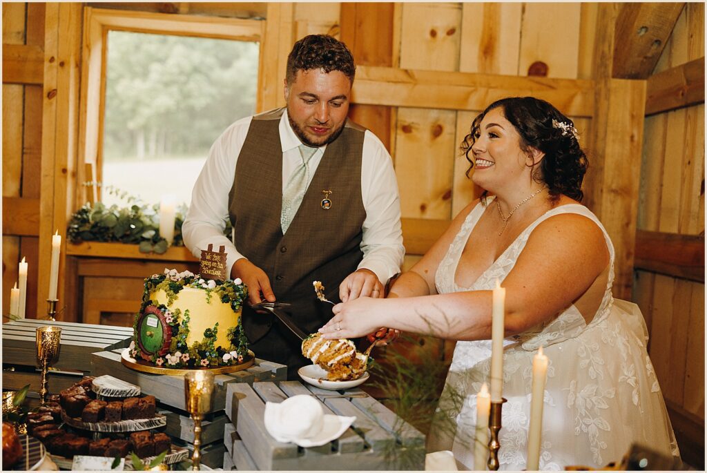 A bride and groom cut a Lord of the Rings wedding cake with a sword.
