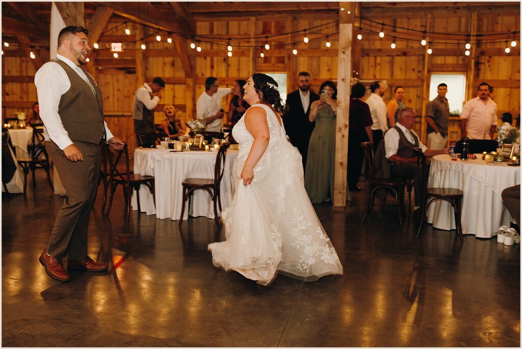 A bride and groom do a choreographed first dance.