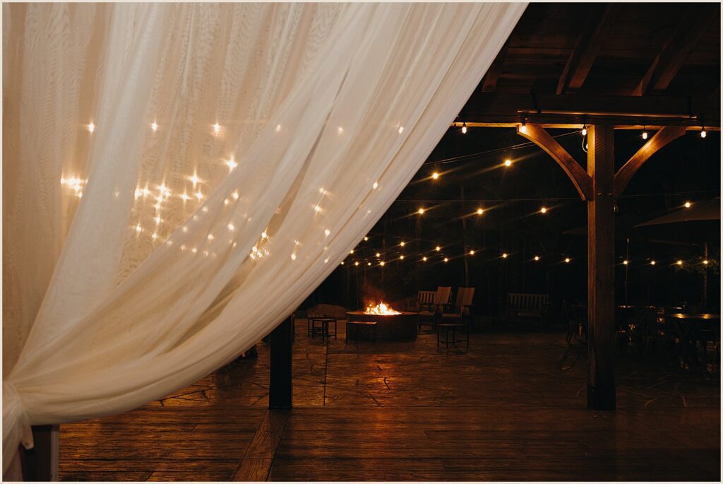 Deck chairs sit around a fire pit.