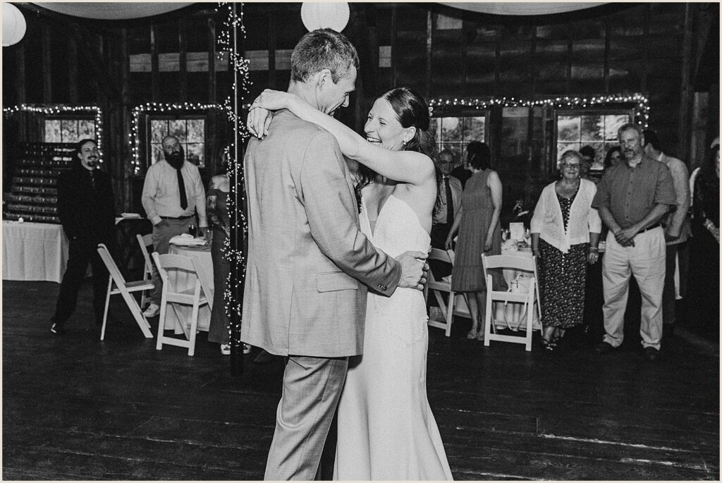 A bride laughs during the first dance.