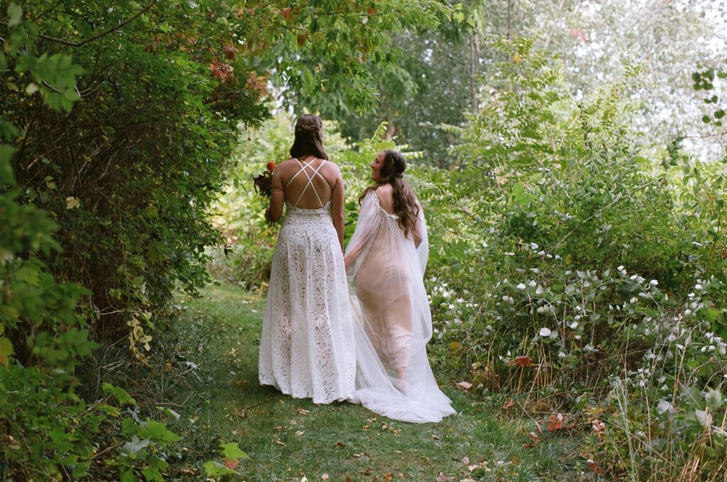 Couple walking together after their wedding ceremony in a quiet, reflective moment.
